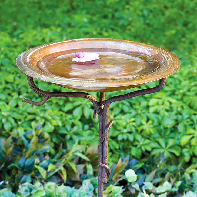 beautiful solid copper bird bath in the garden