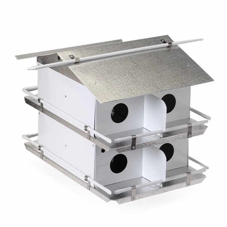 Birdhouse with a metallic roof on a white background